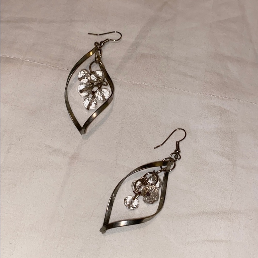 Dangly silver with clear hanging crystals.